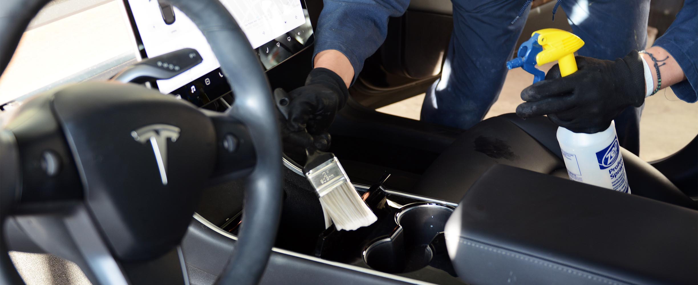 Autodetailing the interior of a Tesla at Technics Auto Body & Detailing in San Bruno, servicing the San Francisco Bay area, Califonia